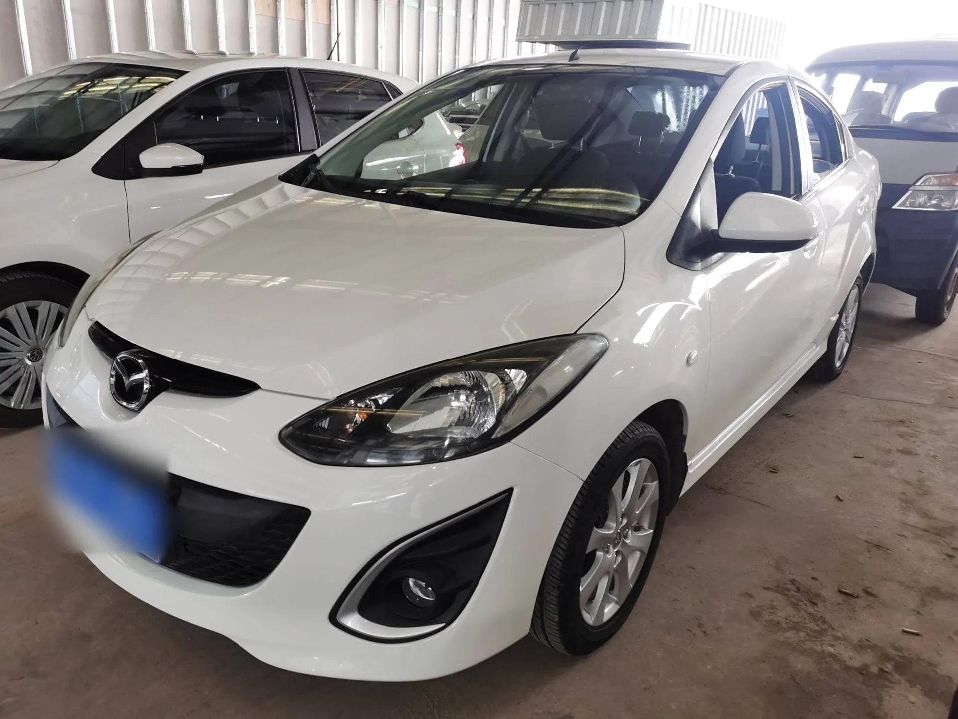 Mazda 2 2012 Sedan XuanDong 1.5L Manual Fashion Edition — миниатюра 1