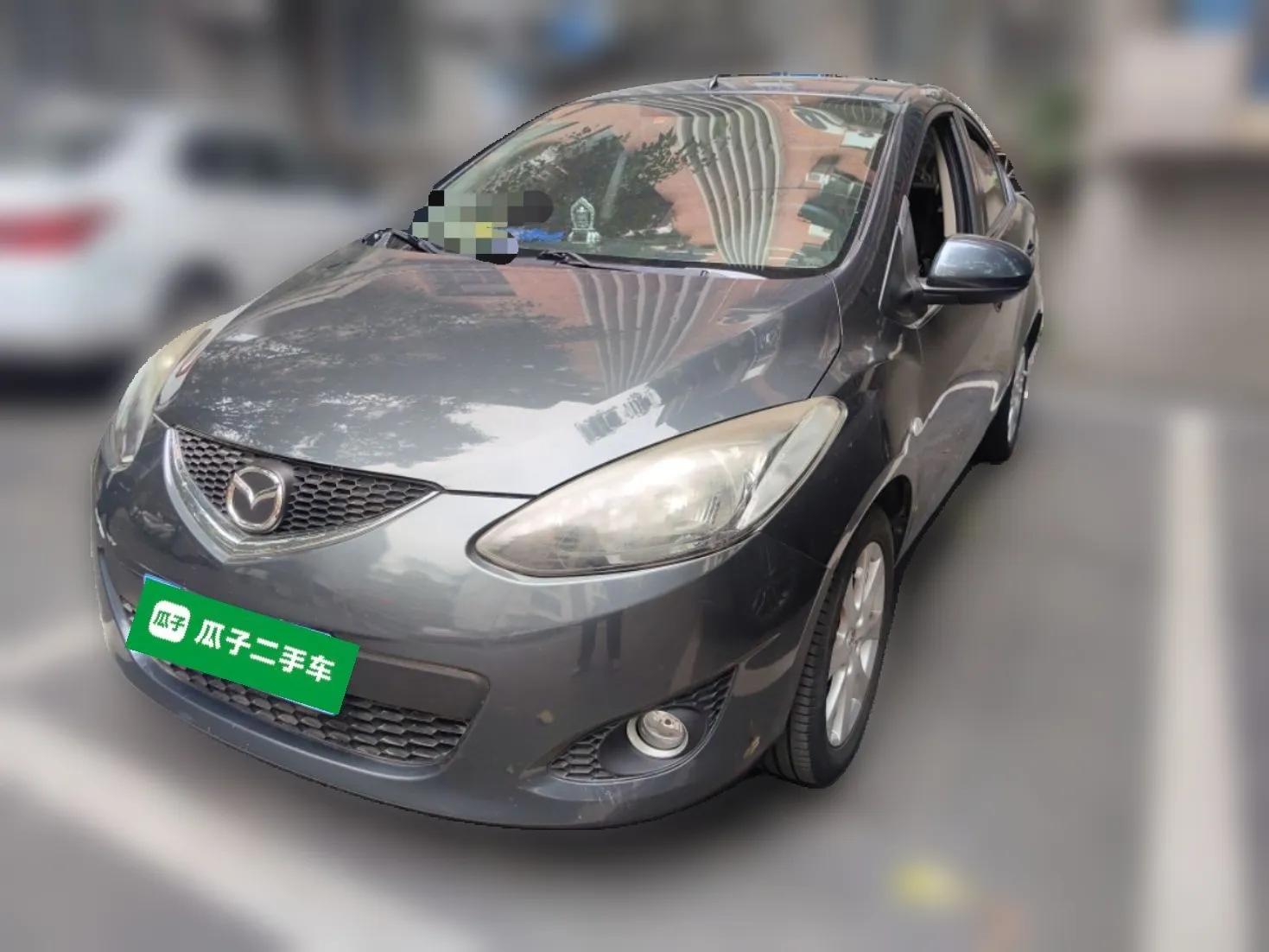 Mazda 2 2011 XuanDong 1.5L Manual Fashion Edition — миниатюра 1